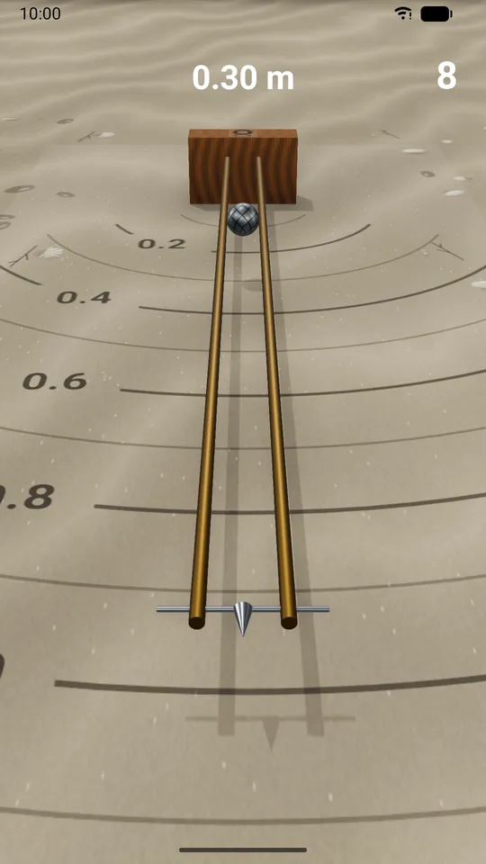 A long jump throw: the ball on the two brass rods, above sand marked in metres
